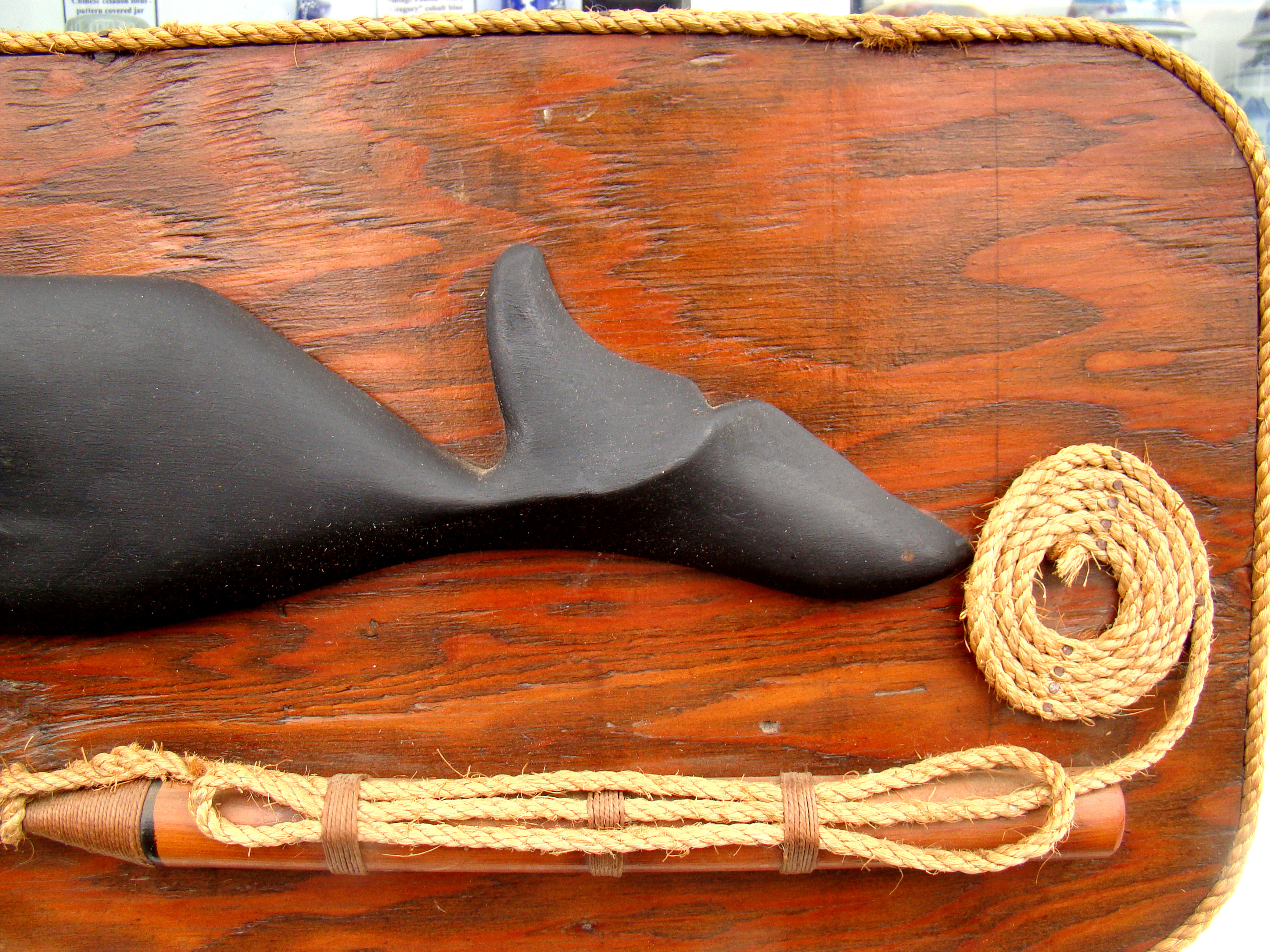 A well-executed carving of a sperm whale mounted on a backboard along with a harpoon — image 3