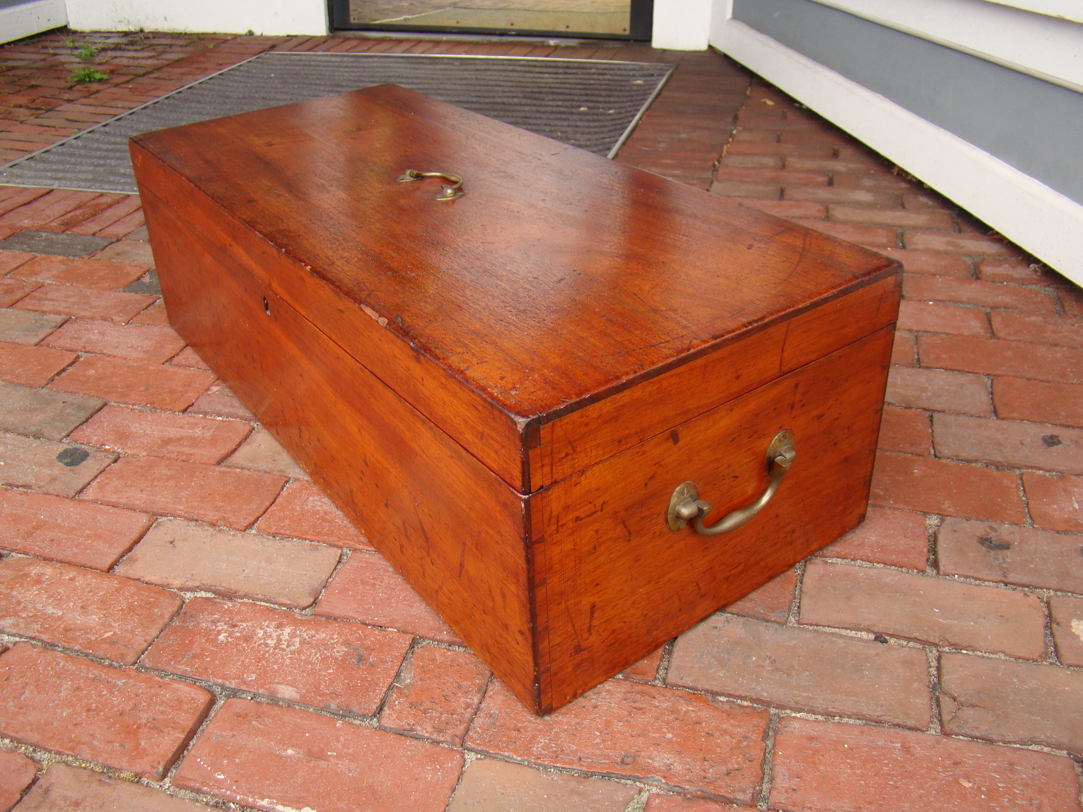 A beautiful antique 19th century cherry seaman's storage chest with fabulous dovetails and three brass mounted handles