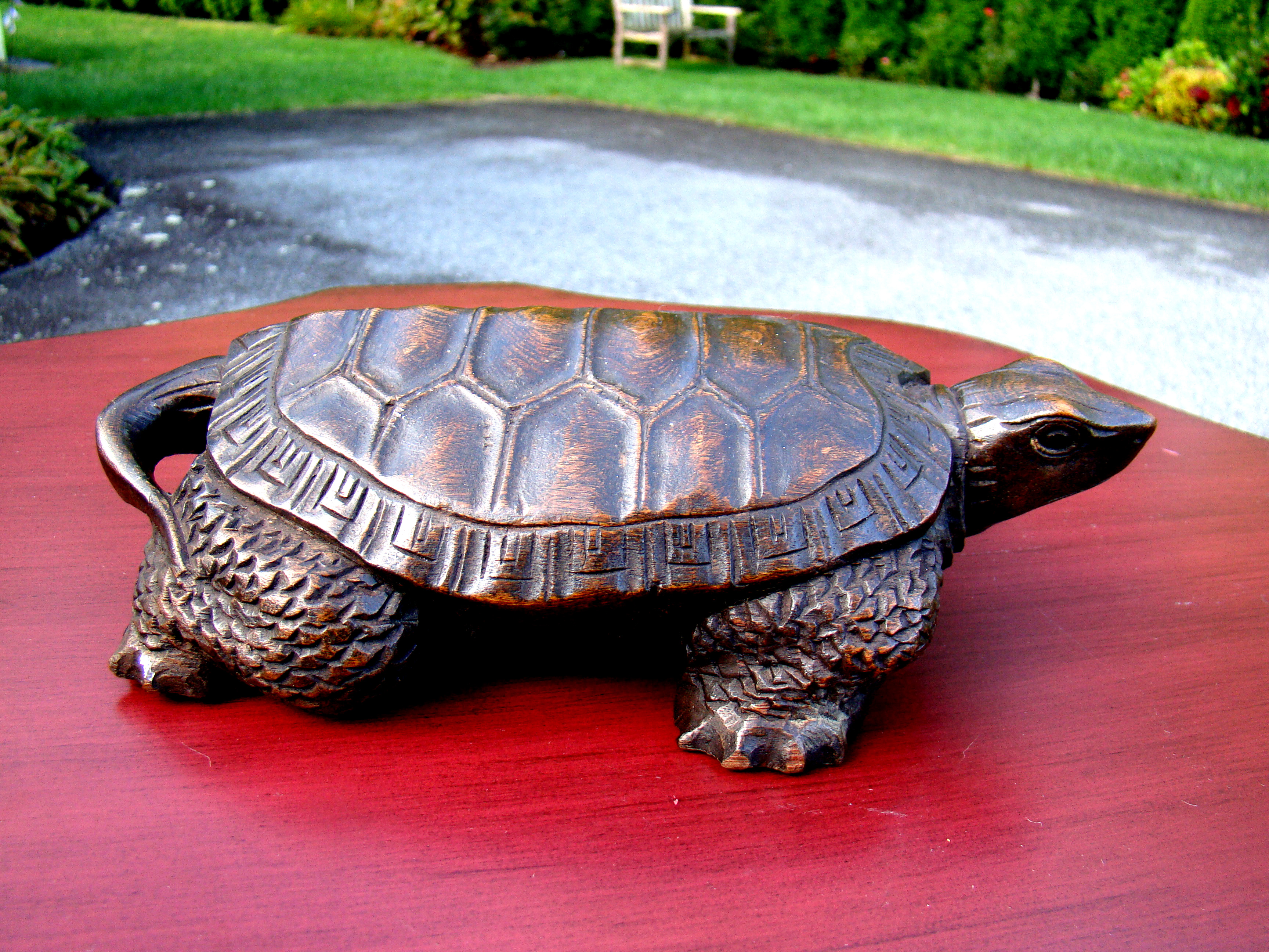 A charming vintage hand carved tortoise circa 1880-1900