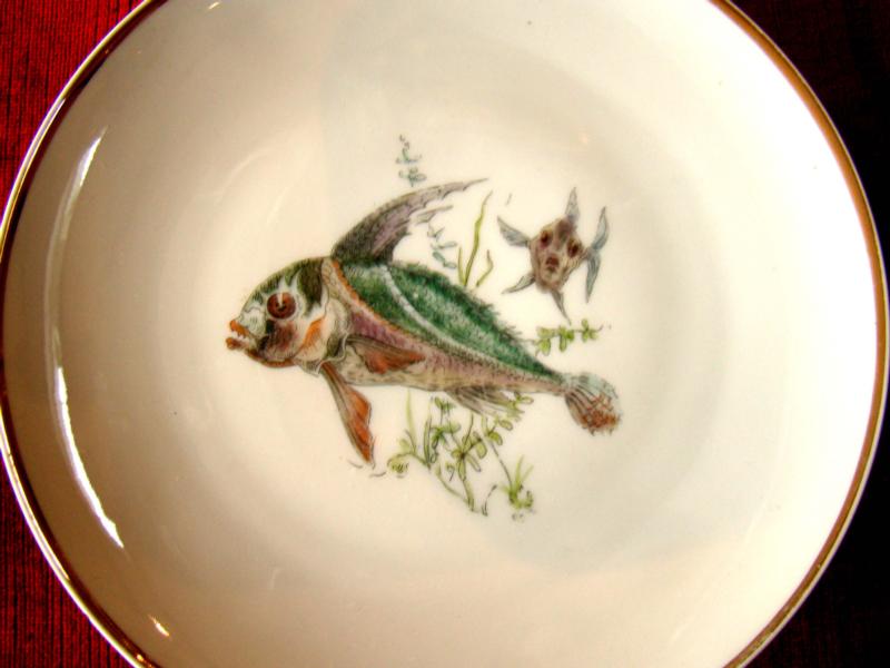 A beautiful set of four hand painted Bavarian fish plates circa 1910