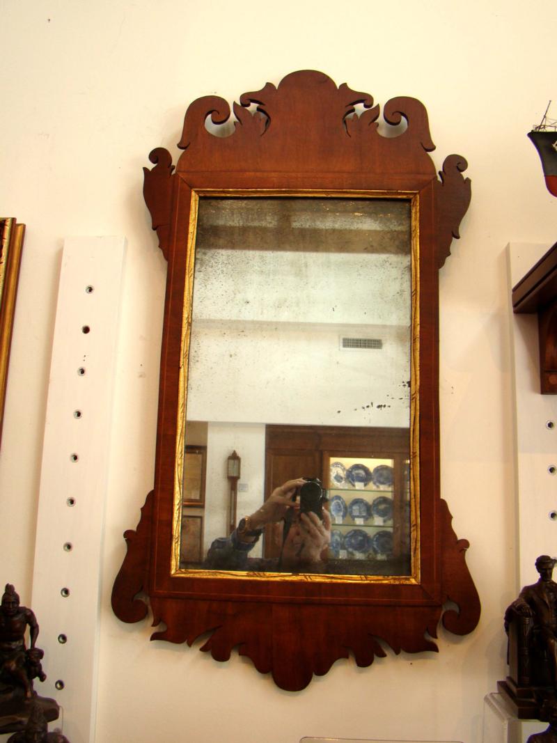 A fine late 18th century Chippendale style walnut mirror with original mirror glass