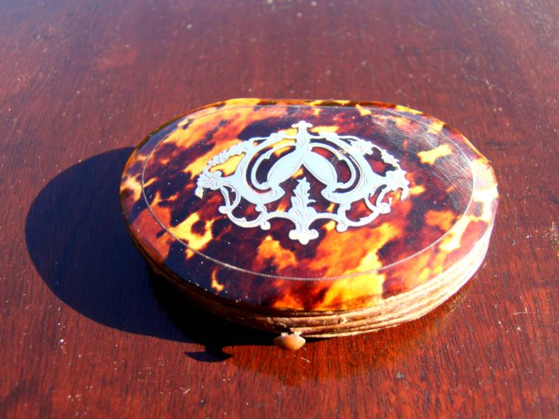 A gorgeous silver inlaid tortoiseshell "theatre" purse circa 1860