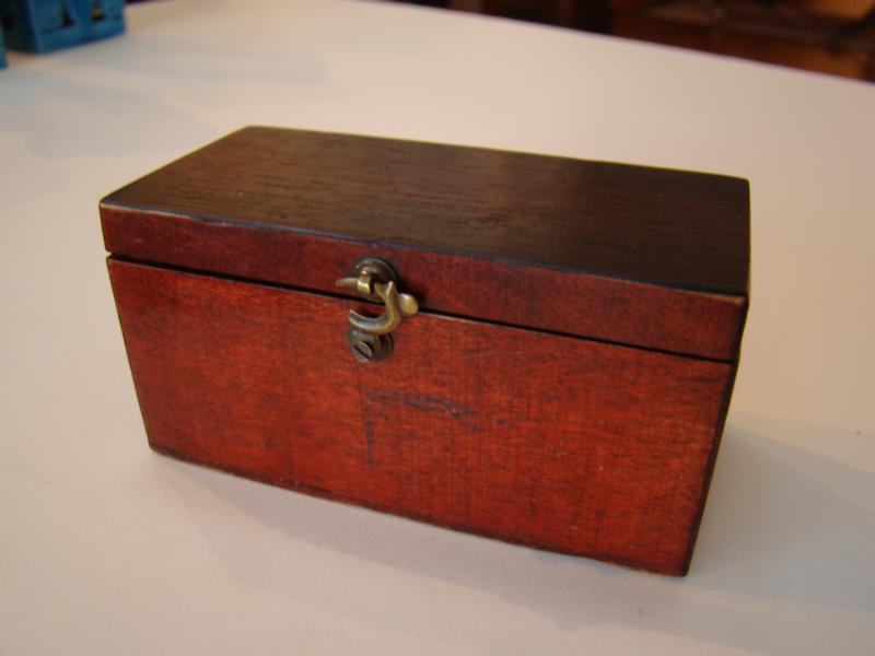 A fine box of dominoes circa 1820 with all 28 bone and ebony pieces