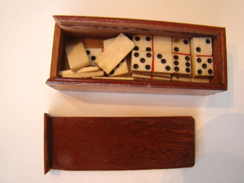 A fine miniature set of dominoes having all 28 bone and ebony pieces circa 1810