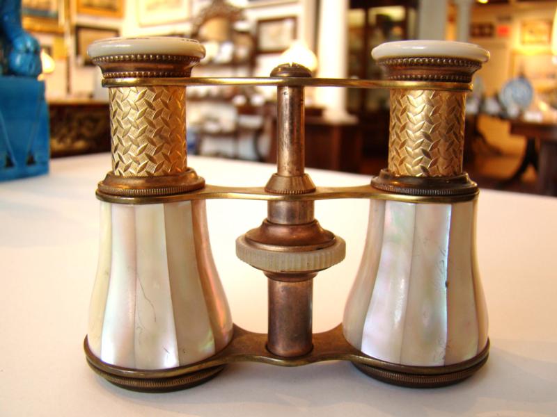 A fine antique pair of mother-of-pearl mounted opera glasses with engraved brass barrels circa 1890