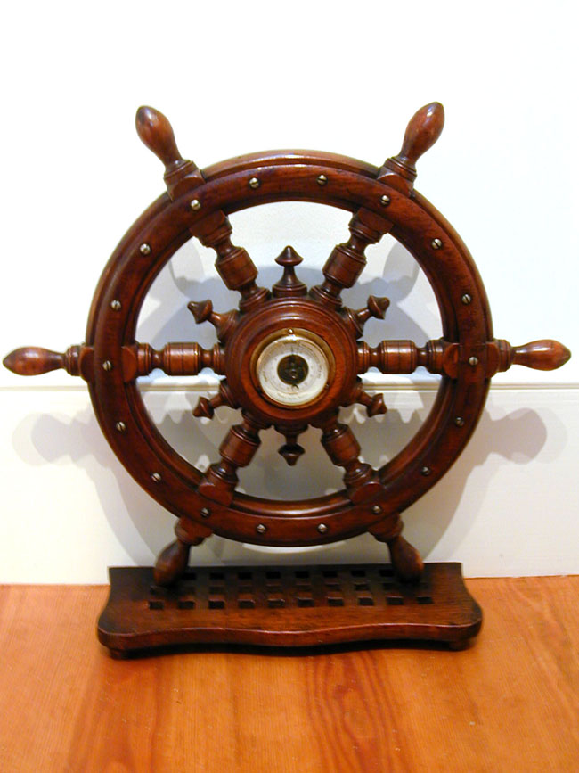Antique Barometer Set into a Ship's Wheel Mounted Onto a Section of Deck Grating