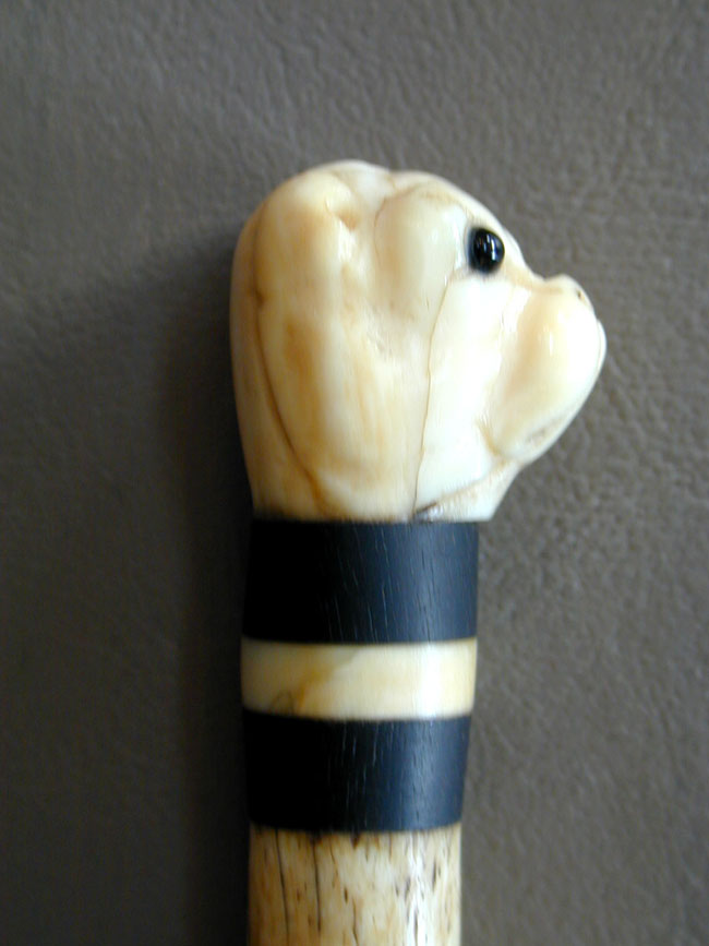 A 19th century Sailor-Made Whalebone Pointer With Whale Ivory Bull Dog Knob