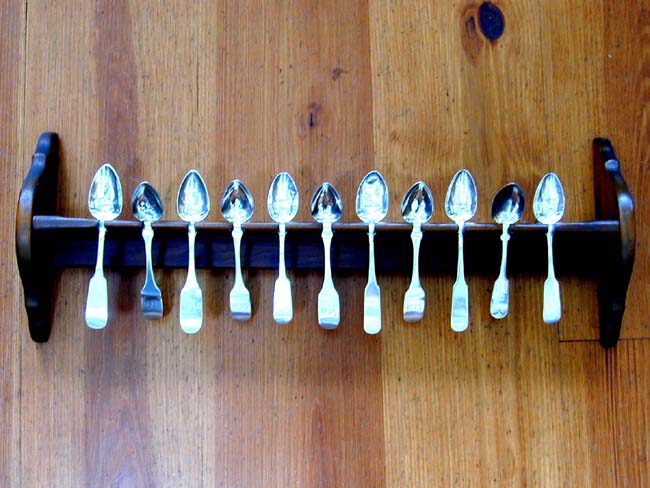 A Collection of 11 Antique Coin Silver Teaspoons on a Custom Made Spoon Rack