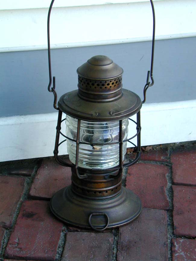 An Antique Hand Carried "Mates" Lamp signed DIETZ circa 1890.