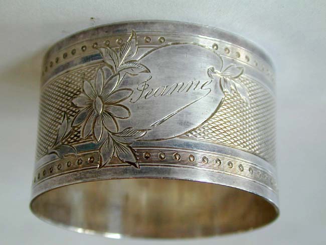 An Antique Sterling Silver Napkin Ring with the name 'Jeanne' circa 1900