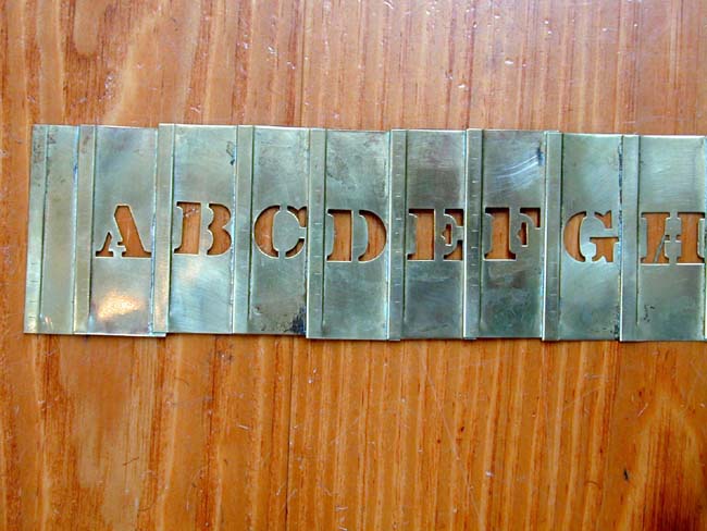 A Late 19th or Early 20th century Folding Brass Stencil
