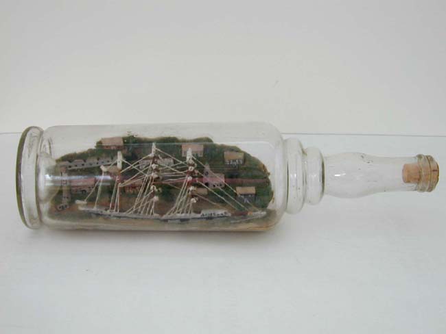 An Early 20th century Sailor-made Ship-in-a Bottle