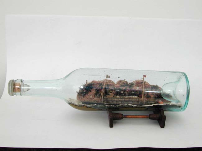 A Rare Late 19th century American Auxiliary Steam and Sail Ship in a Bottle with Village Background