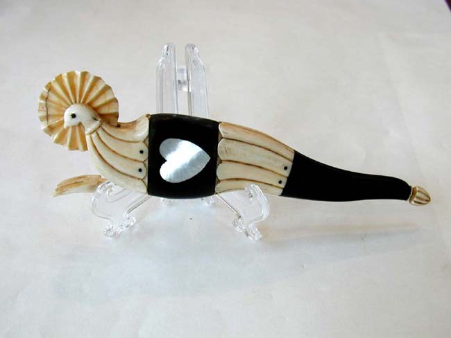 A Late 19th Century Sailor-Made Whalebone and Ebony Pie Crimper with Inlaid Abalone Hearts circa 1880