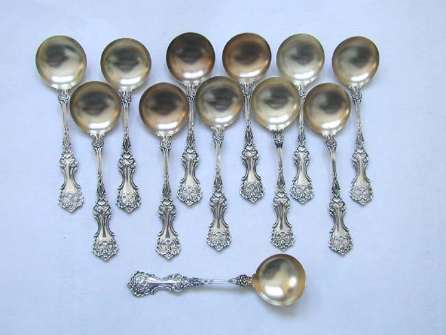 A Set of 12 Antique Sterling Silver Bouillon Spoons in the 'Pompadour' pattern made by the Whiting Silver Company circa 1898