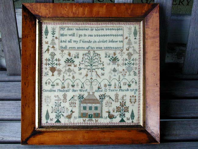 A Scottish School Girl Needlework Sampler signed "Caroline Metcalf, Glasgow, Aged 12, March 25, 1831