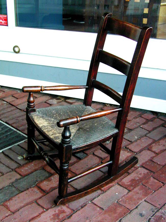 An Early 19th Century English Oak Child's Rocking Chair With Original Rush Seat