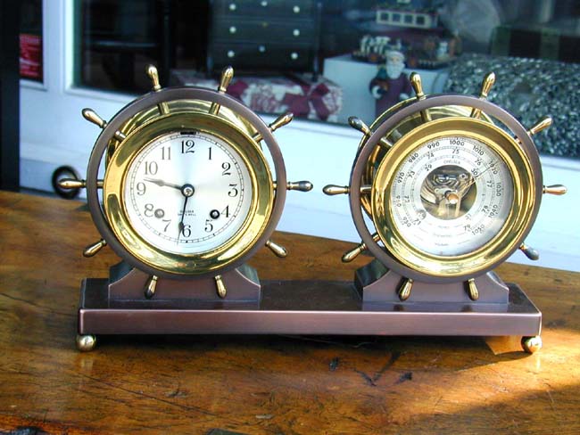 A Chelsea Ship's Bell Clock and Barometer Set in a Bronze Base Circa 1948